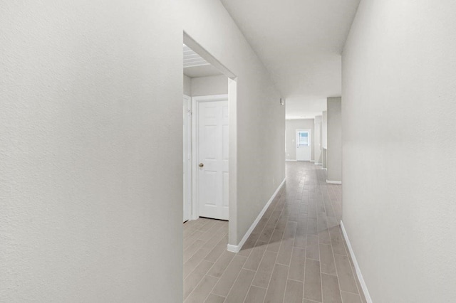 26400 Cooperstown Way, Splendora, TX 77372 - hall featuring wood tiled floor and baseboards