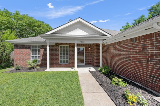 17402 Eastwood Cir, Houston, TX 77095 - entrance to property with a lawn, brick siding, and roof with shingles