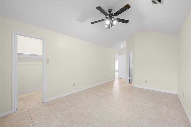 17402 Eastwood Cir, Houston, TX 77095 - empty room with lofted ceiling, ceiling fan, light tile patterned flooring, and baseboards
