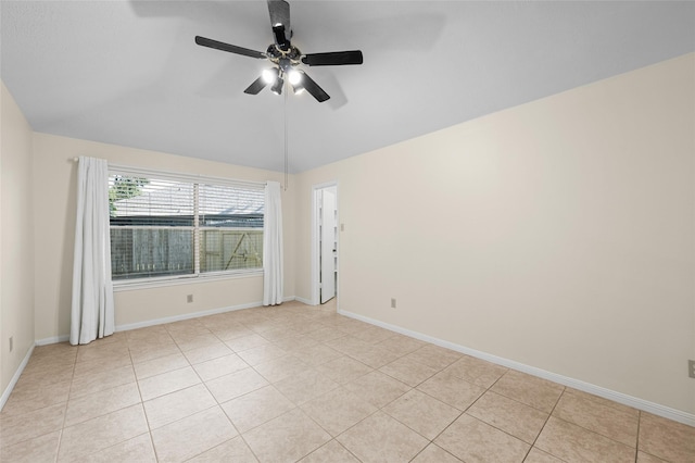 17402 Eastwood Cir, Houston, TX 77095 - spare room featuring vaulted ceiling, ceiling fan, light tile patterned floors, and baseboards