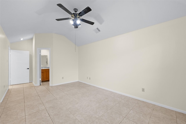 17402 Eastwood Cir, Houston, TX 77095 - spare room with vaulted ceiling, ceiling fan, baseboards, and light tile patterned floors