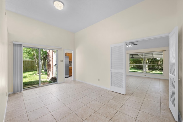 17402 Eastwood Cir, Houston, TX 77095 - unfurnished room featuring light tile patterned floors, baseboards, and a ceiling fan