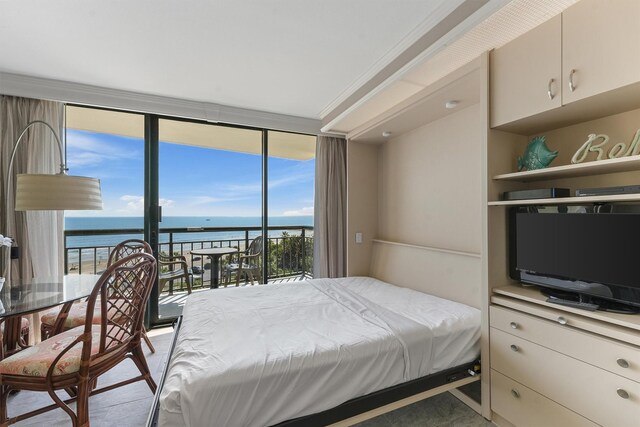 5220 Seawall Blvd Unit 738D, Galveston, TX 77551 - bedroom featuring a wall of windows and access to exterior