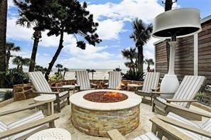 5220 Seawall Blvd Unit 738D, Galveston, TX 77551 - view of patio with an outdoor fire pit