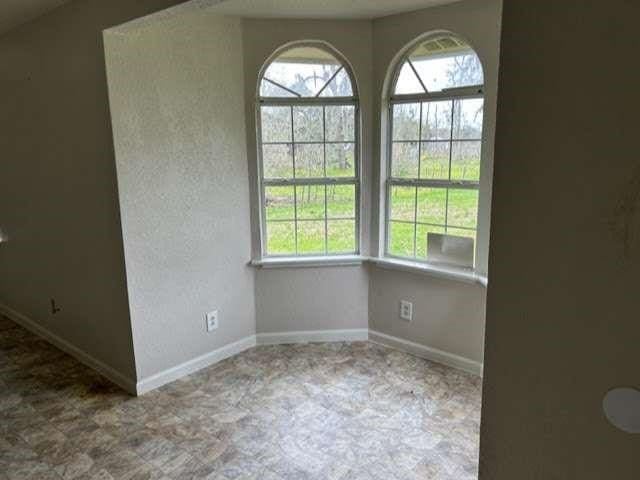 interior space featuring baseboards