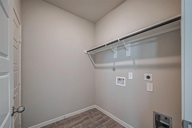 clothes washing area with hookup for an electric dryer, baseboards, hookup for a washing machine, wood finish floors, and laundry area