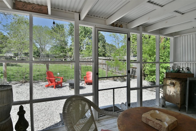 sunroom / solarium featuring an outdoor fire pit