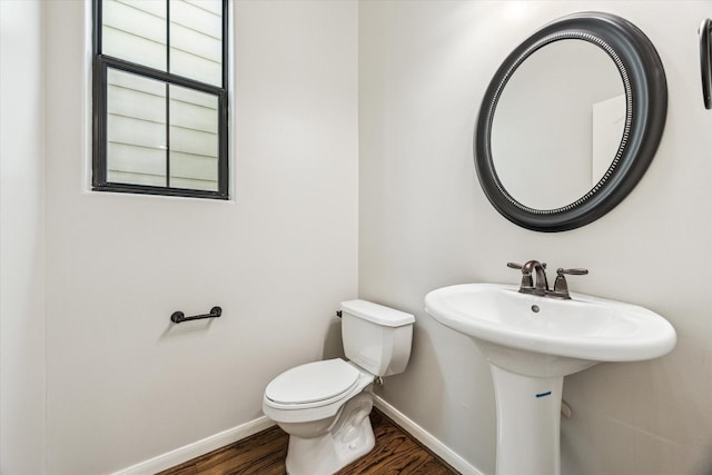 5308 Larkin St Unit B, Houston, TX 77007 - half bathroom with wood finished floors, baseboards, a sink, and toilet