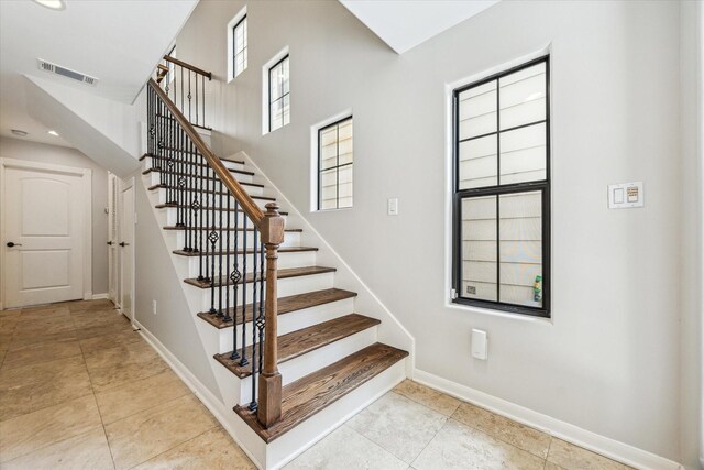 5308 Larkin St Unit B, Houston, TX 77007 - staircase with baseboards, tile patterned floors, visible vents, and recessed lighting
