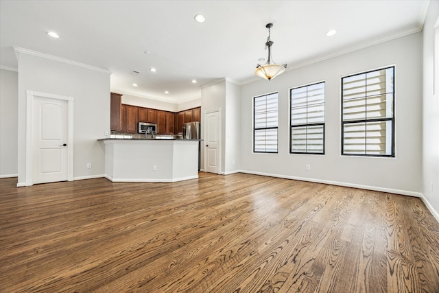 5308 Larkin St Unit B, Houston, TX 77007 - unfurnished living room with ornamental molding, wood finished floors, and recessed lighting