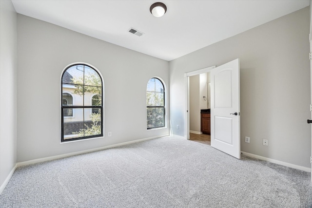 5308 Larkin St Unit B, Houston, TX 77007 - unfurnished bedroom with carpet, visible vents, and baseboards