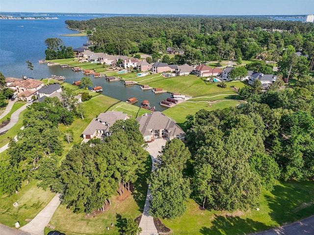 18762 Grand Harbor Pt, Montgomery, TX 77356 - view of property location featuring a nearby body of water, nearby suburban area, and a heavily wooded area