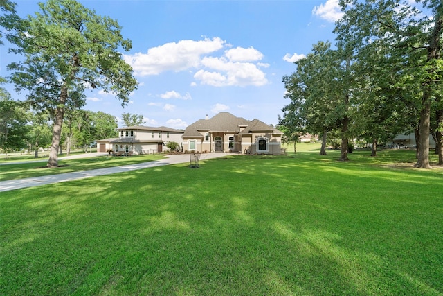 18762 Grand Harbor Pt, Montgomery, TX 77356 - view of front of house with a front lawn and stucco siding