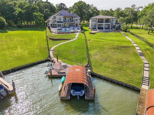 18762 Grand Harbor Pt, Montgomery, TX 77356 - dock area featuring a water view, a lawn, and boat lift