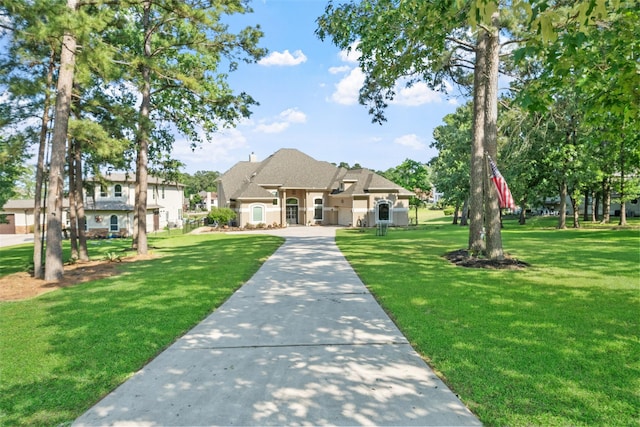 18762 Grand Harbor Pt, Montgomery, TX 77356 - view of front of home with a front lawn