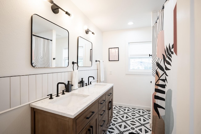2407 Stonecrest Dr, Houston, TX 77018 - full bathroom featuring a sink, double vanity, baseboards, and tile patterned floors