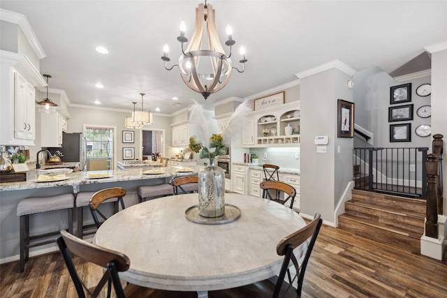 dining space featuring dark wood-style floors, recessed lighting, a chandelier, stairway, and crown molding