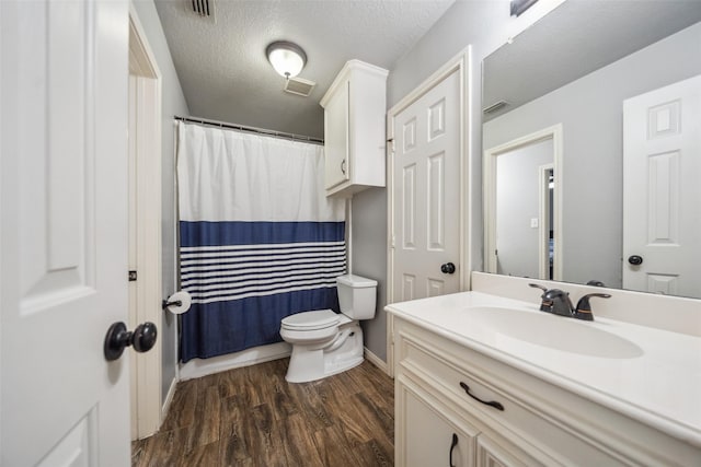full bath with wood finished floors, visible vents, toilet, vanity, and baseboards