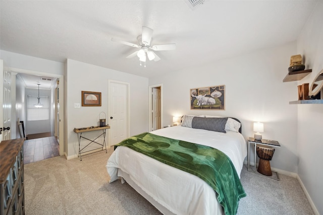 bedroom featuring carpet, a ceiling fan, and baseboards
