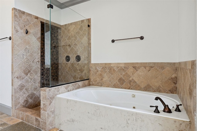 full bathroom with a whirlpool tub and a shower stall