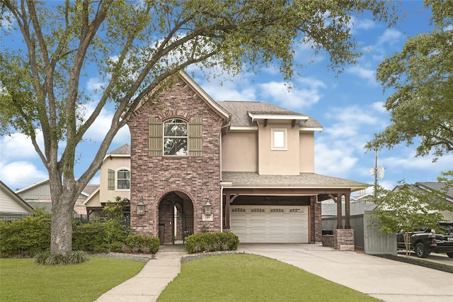 2419 Briarhurst Dr, Houston, TX 77057 - traditional-style home with brick siding, driveway, a shingled roof, a garage, and a front yard