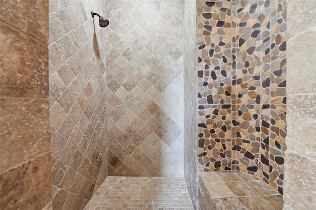 bathroom with a tile shower