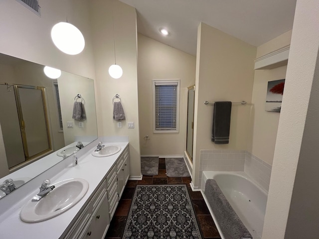 full bathroom with a sink, double vanity, and a stall shower
