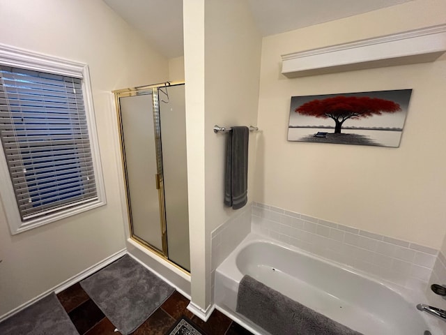 full bath with a garden tub and a stall shower