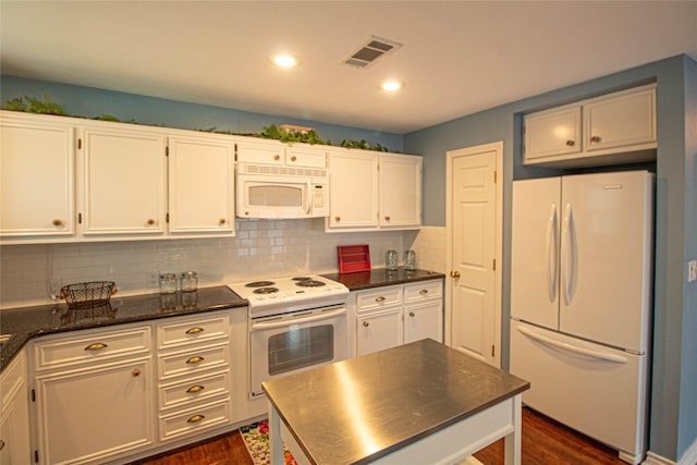 kitchen with visible vents, dark wood-type flooring, white appliances, and white cabinetry