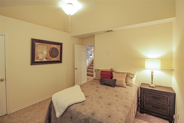 carpeted bedroom featuring baseboards and visible vents