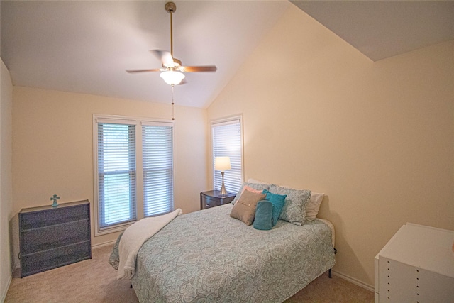 bedroom featuring lofted ceiling, baseboards, carpet flooring, and ceiling fan