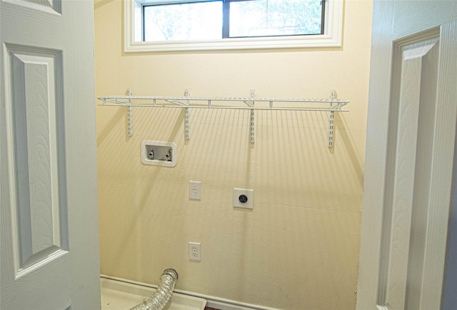 clothes washing area featuring washer hookup, electric dryer hookup, and laundry area