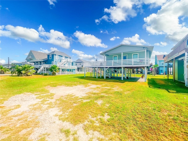 13106 Coronado Dr, Freeport, TX 77541 - back of property featuring a yard and stairs