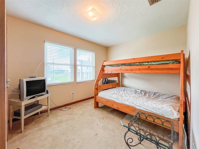 13106 Coronado Dr, Freeport, TX 77541 - bedroom featuring carpet floors and a textured ceiling