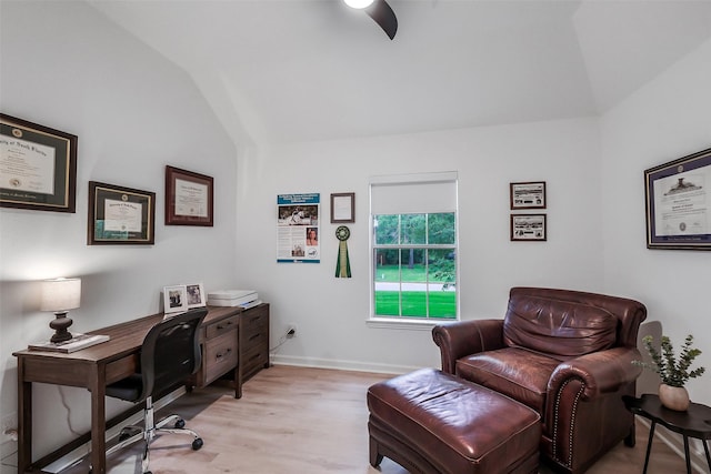 home office with baseboards, light wood finished floors, ceiling fan, and lofted ceiling
