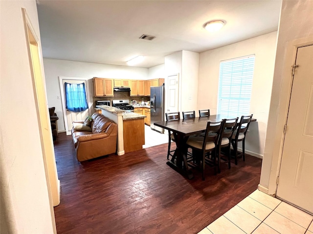 6022 Yorkglen Manor Ln, Houston, TX 77084 - dining space featuring light wood-style flooring, healthy amount of natural light, and baseboards