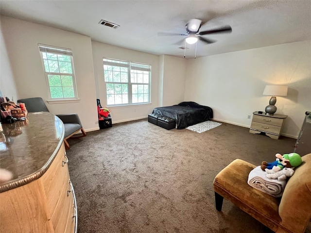 6022 Yorkglen Manor Ln, Houston, TX 77084 - bedroom with baseboards, carpet, and ceiling fan