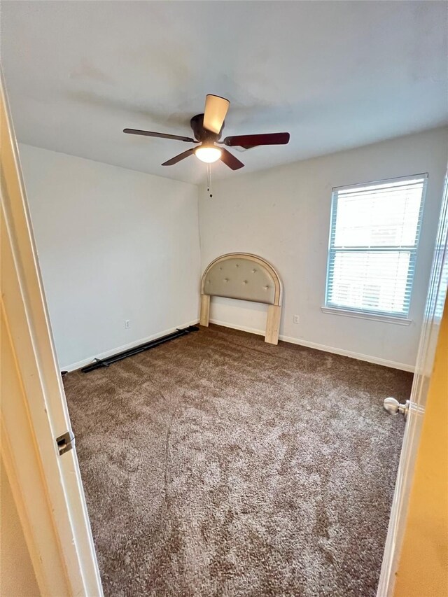 6022 Yorkglen Manor Ln, Houston, TX 77084 - carpeted empty room featuring a ceiling fan and baseboards
