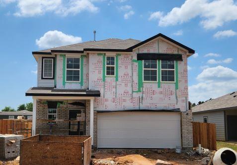 17848 Lionheart Rd, Conroe, TX 77306 - view of front of house with an attached garage and fence