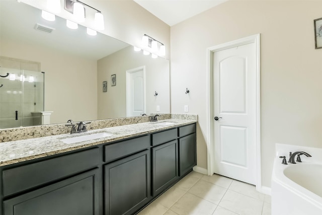 full bath featuring a garden tub, tile patterned floors, a sink, a stall shower, and visible vents
