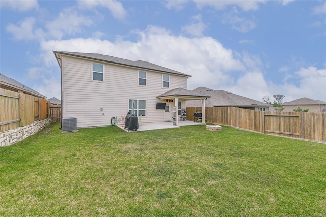 back of property with central air condition unit, a yard, a patio, and a fenced backyard