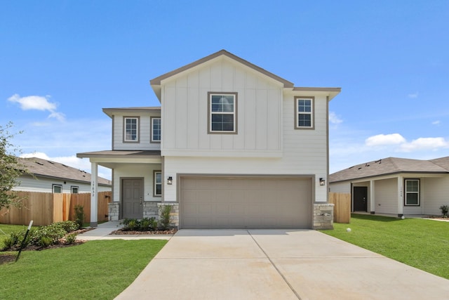 17832 Lionheart Rd, Conroe, TX 77306 - view of front of home with board and batten siding, driveway, stone siding, and an attached garage