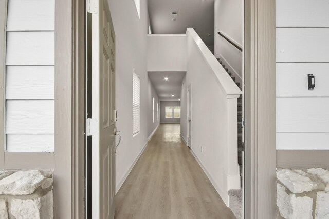 17832 Lionheart Rd, Conroe, TX 77306 - hall featuring light wood finished floors and baseboards