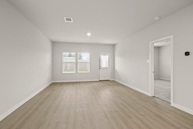 17832 Lionheart Rd, Conroe, TX 77306 - spare room with light wood finished floors, baseboards, and a smoke detector