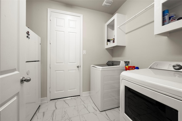 17010 Bainham Forest Trl, Hockley, TX 77447 - washroom featuring light marble finish floors, washer and dryer, and baseboards