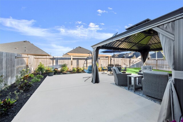 17010 Bainham Forest Trl, Hockley, TX 77447 - fenced backyard featuring a gazebo, outdoor lounge area, and a patio