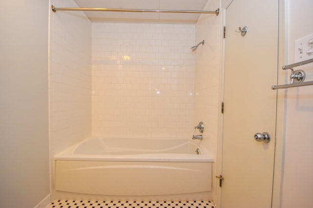915 Franklin St Unit 4A, Houston, TX 77002 - bathroom featuring tile patterned floors and shower / bathtub combination