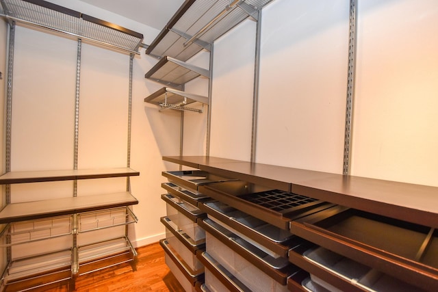915 Franklin St Unit 4A, Houston, TX 77002 - walk in closet featuring wood finished floors