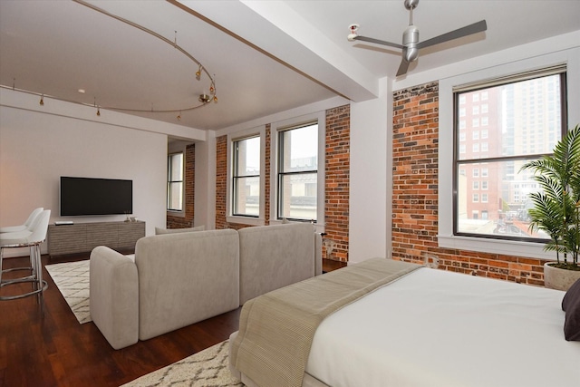 915 Franklin St Unit 4A, Houston, TX 77002 - bedroom with brick wall, wood finished floors, and multiple windows