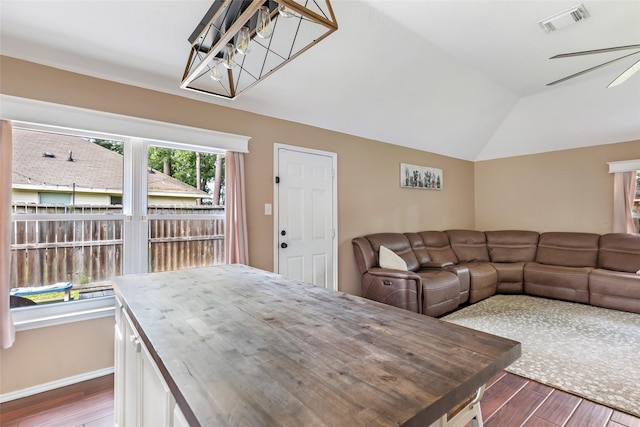 17110 Cutter Way, Crosby, TX 77532 - dining space featuring wood finished floors, vaulted ceiling, ceiling fan, baseboards, and a chandelier